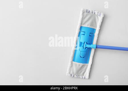 Floor mop on light background Stock Photo