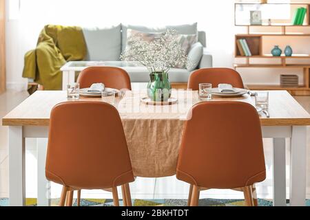 Served table in modern dining room Stock Photo