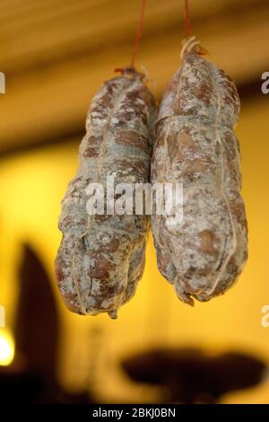 France, Paris, Chez Eux bistro, dry sausage on the wall Stock Photo