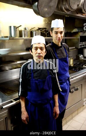 France, Paris, Chez Eux bistro, apprentices and clerks Faycal and Lam Stock Photo