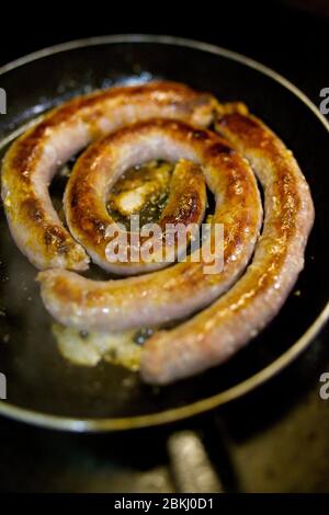 France, Paris, Chez Eux bistro, sausage cooking by the meter Stock Photo