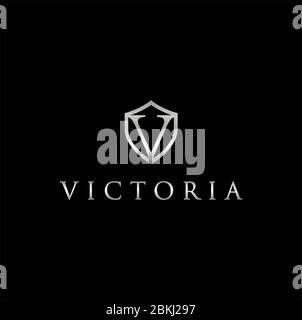 Initial v with shield metal metallic silver logo on a dark background Stock Vector