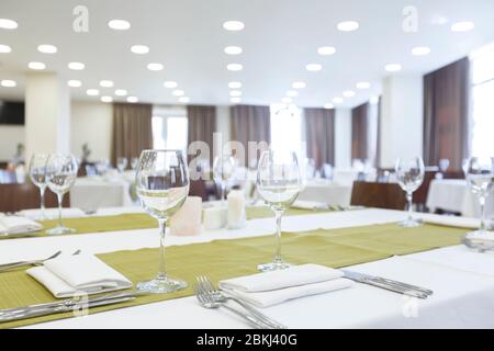 Empty stylish table in restaurant with glasses Stock Photo