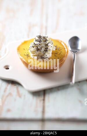 Poppy whipped lemon tart Stock Photo