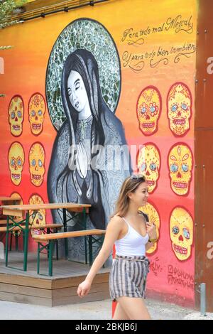 Portugal, Lisbon, Alcantara district, LX Factory installed in an old industrial area of ??23,000 m2, street art with a Madonna and Mexican skulls Stock Photo