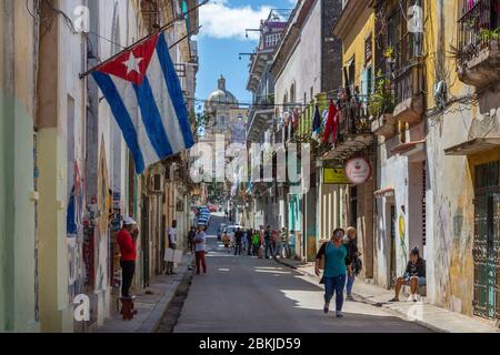 Cuba, Havana, district of La Habana Vieja classified World Heritage of Unesco, street with Cuban flag and museum of revolution in the background Stock Photo