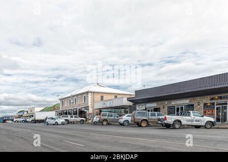 HARRISMITH, SOUTH AFRICA - MARCH 16, 2020:  A street scene, with businesses and vehicles, in Harrismith in the Free State Province Stock Photo