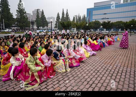 North Korea, Pyongyang, students dancing for the national day comemorating the foundation of the North Korean Popular Republic Stock Photo