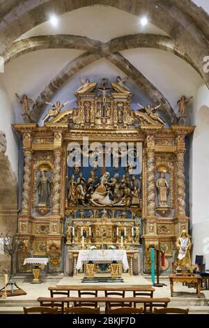 France, Var, Dracenie, Les Arcs sur Argens, Ste Roseline Chapel, baroque high altar surrounded by a sculpted altarpiece that frames a Descent from the Cross from the early 16th century Stock Photo
