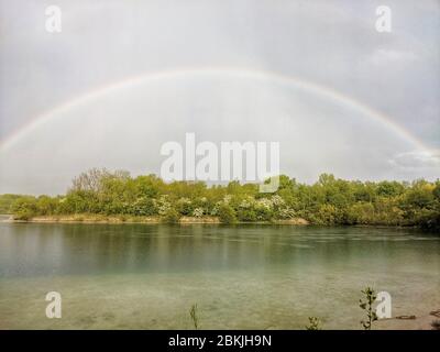 Munich, Bavaria, Germany. 4th May, 2020. In the Lake Langwied (Langwiedersee) area of Munich, Germany a double rainbow forms during changing, turbulent weather which included periods of heavy rains. Credit: Sachelle Babbar/ZUMA Wire/Alamy Live News Stock Photo