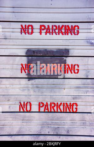 No parking signs on a dirty old background Stock Photo