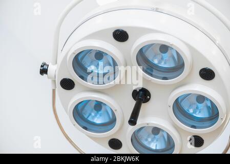 Large surgical lamp in the operating room. View from below. Medical concept background Stock Photo