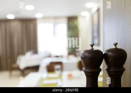 Focus on salt shaker and pepper shaker in restaurant Stock Photo