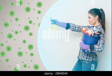 Young girl with cleaning supplies fighting against virus cells, protected by invisible shield, collage with empty space Stock Photo