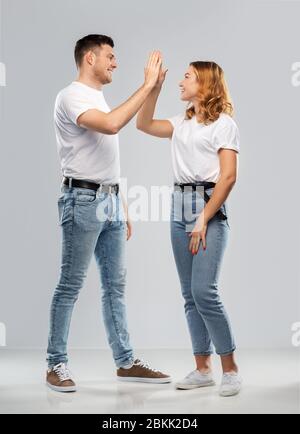 happy couple making high five gesture Stock Photo