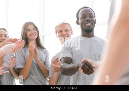 close up. a group of young people meeting the speaker with applause. Stock Photo