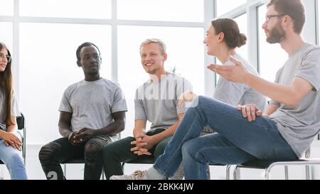 group of young like-minded people discussing their ideas Stock Photo