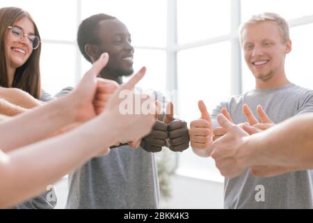 close up. group of like-minded showing thumbs up. Stock Photo