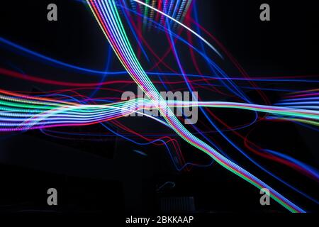 Drone lightpainting with different colors and crossing lines Stock Photo