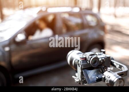 Backstage concept. Filming an advertisement or series or movie. Close-up of a video camera on the stabilizer Stock Photo