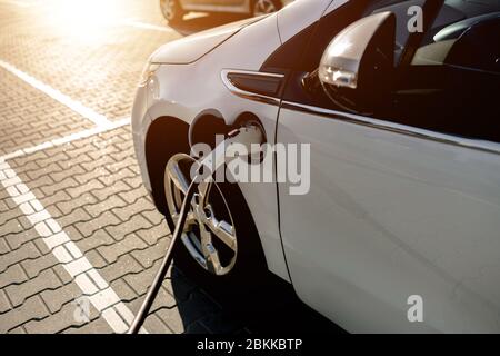 electric car, charging station on the street, in the parking lot Shopping Mall Stock Photo