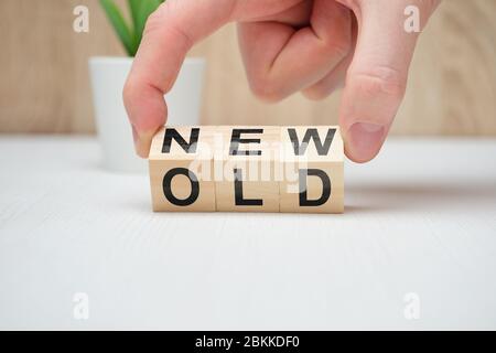 Concept change old is new on wooden blocks. Close up. Stock Photo
