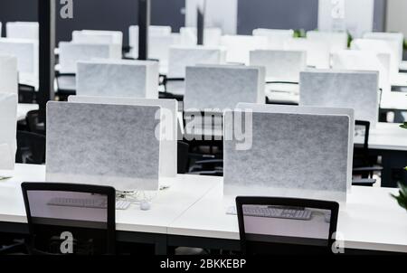 Empty places for workers in big empty rental office Stock Photo