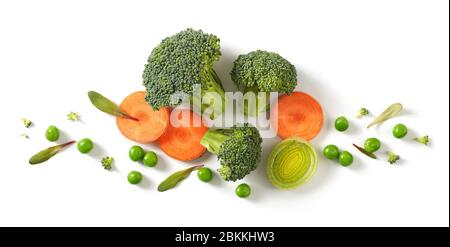 composition of fresh broccoli, carrot and green peas isolated on white background, top view Stock Photo