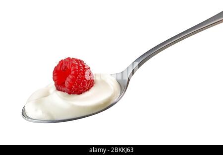 spoon of yogurt cream with raspberry isolated on white background Stock Photo