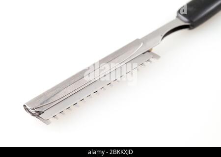 Metal color sharp straight razor on a bright isolated on white Stock Photo