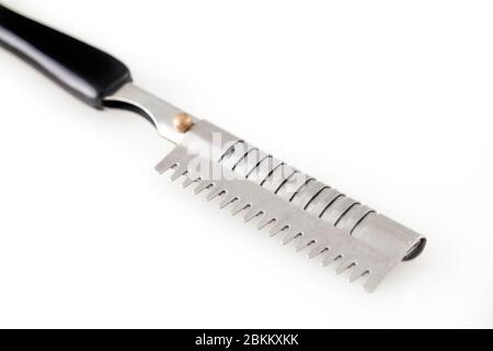 Metal color sharp straight razor on a bright isolated on white Stock Photo