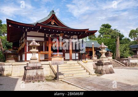 The view of the Haiden of Shikichi-jinja Shrine (Wara-tenjin) with the two stone lantern in front of it. Kyoto. Japan Stock Photo