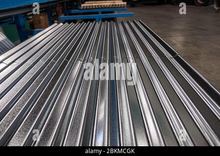 Metal Corrugated roofing profiles in metal roofing factory Stock Photo