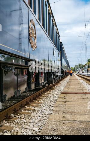 Ruse city, Bulgaria - August 29, 2017. The legendary Venice Simplon Orient Express is ready to depart from Ruse Railway station. Sleeper. The luxury t Stock Photo