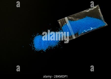 plastic envelope with blue drugs Stock Photo