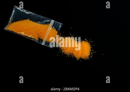 plastic envelope with orange drugs Stock Photo