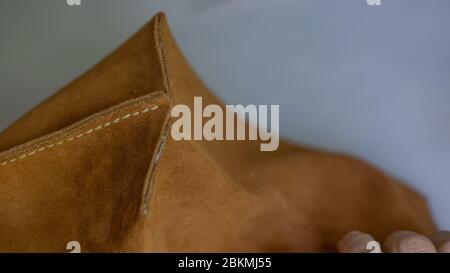 Handmade handicraft leather bag sewing process. Leather workshop, working with leather Stock Photo