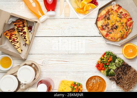 Flat lay with takeaway food on wooden background. Food delivery Stock Photo