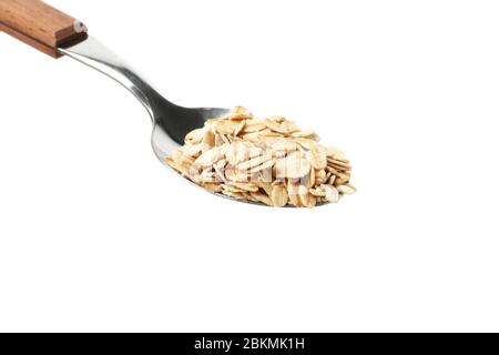 Spoon with oatmeal flakes isolated on white background Stock Photo