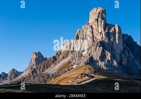 Italian Dolomites mountain (Ra Gusela rock in front) peaceful sunny evening view from Giau Pass. Picturesque climate, environment and travel concept s Stock Photo