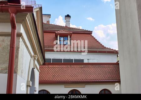 Building with red clay tiles roof in Vilnius old town Stock Photo