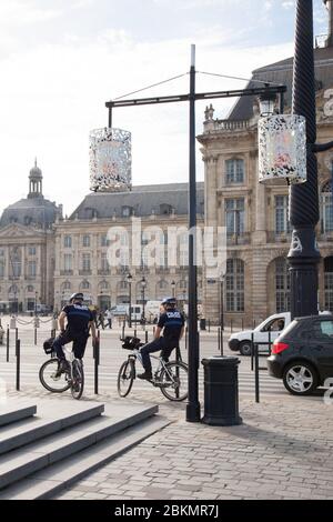 Bordeaux , Aquitaine / France - 11 07 2019 : bordeaux Police man on bikes Policeman uniforms on  Bicycle on city street Stock Photo