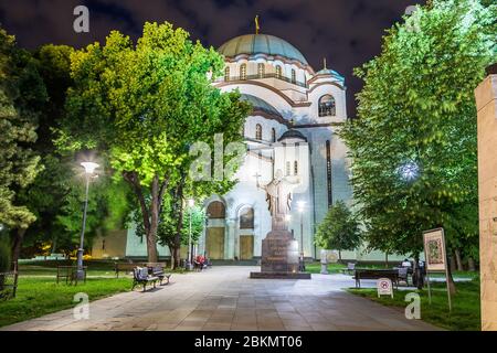 BELGRADE, SERBIA - 7TH MAY 2018: The outside of the side of Church of Saint Sava in Belgrade the capital of Serbia at night. People can be seen. Stock Photo
