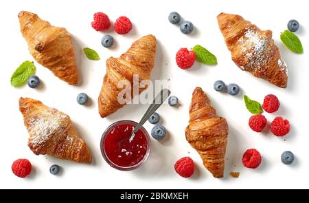 freshly baked croissants on white background, top view Stock Photo