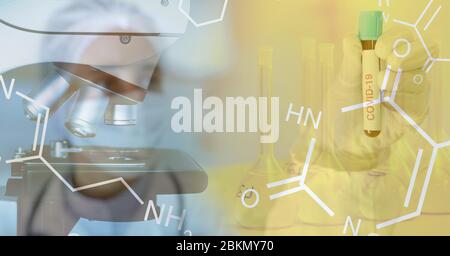 Digital illustration of a microscope and a chemical element over a scientist holding a test tube Stock Photo