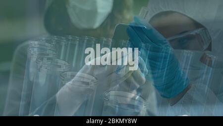 Digital illustration of a scientist holding a test tube over a woman walking and using a smartphone Stock Photo