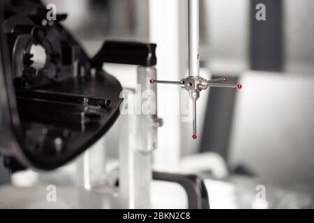 Close up of 3D dimension measurement plastic parts by CMM, 3D automatic measuring system Stock Photo