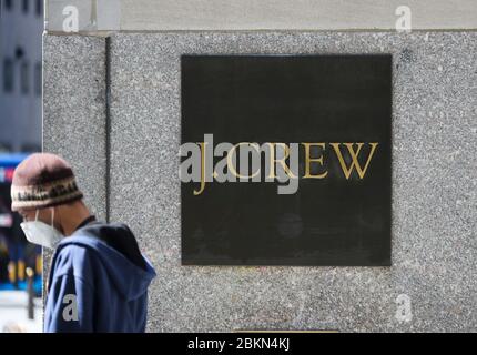 (200505) -- NEW YORK, May 5, 2020 (Xinhua) -- A pedestrian walks past a J.Crew store in Manhattan of New York, the United States, May 4, 2020. J. Crew Group, a U.S. apparel retailer which also operates the Madewell brand, has filed for bankruptcy protection, as the COVID-19 fallout continues to ripple through the nation. It has filed to begin Chapter 11 proceedings in the U.S. Bankruptcy Court for the Eastern District of Virginia, according to a statement by the company on Monday. The company said its lenders have agreed to convert approximately 1.65 billion U.S. dollars of its debt int Stock Photo