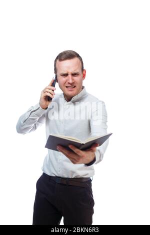 man businessman, teacher, mentor examines entries in your diary and talking on a cell phone. Isolated on white background Stock Photo