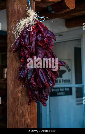 A ristra of drying chili peppers in the Albuquerque Old Town area, New Mexico, USA. Stock Photo